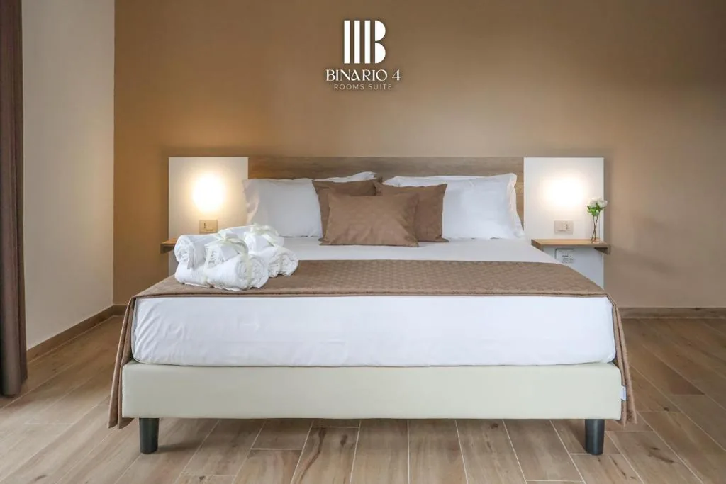 Camera Quadrupla Deluxe — Binario 4 Rooms Suite