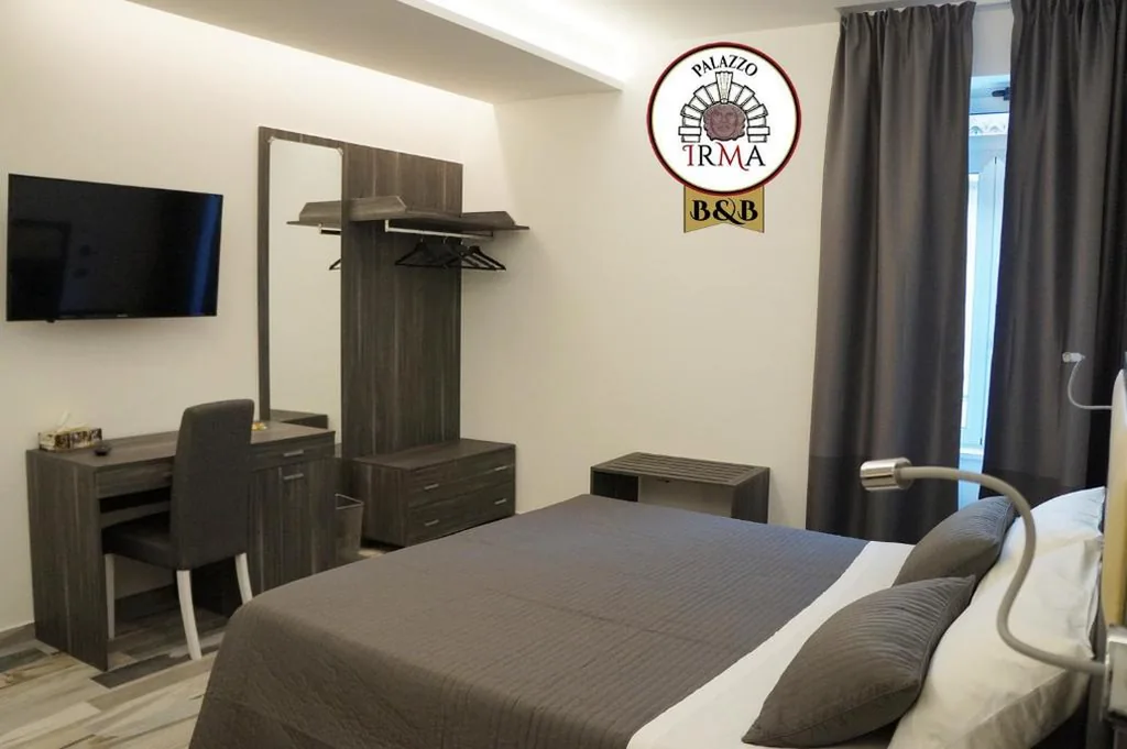 Deluxe Quadruple Room — Palazzo IrMa – Hotel – B&B Luxury