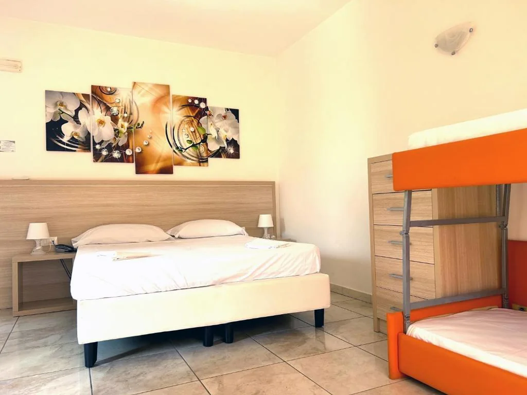 Quadruple Room — Hotel Park Village