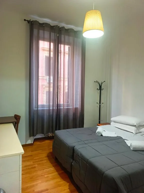 Camera Deluxe Doppia con Letti Singoli — Niam House