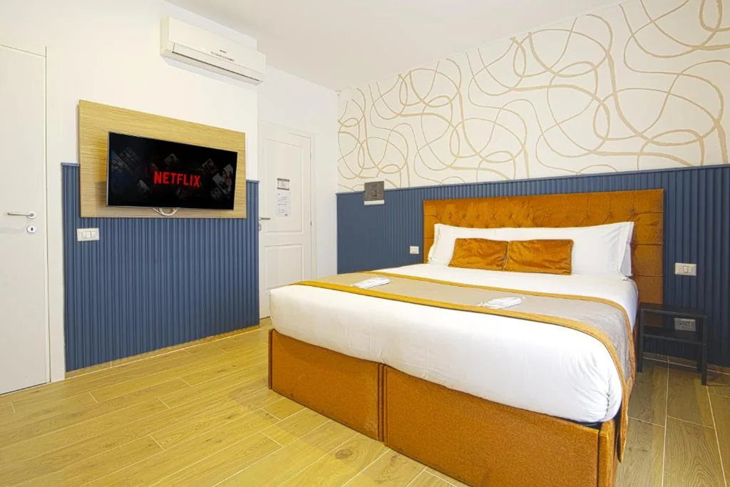 Camera Deluxe Matrimoniale/Doppia con Letti Singoli — Home at Rome Vatican Apartment&Rooms