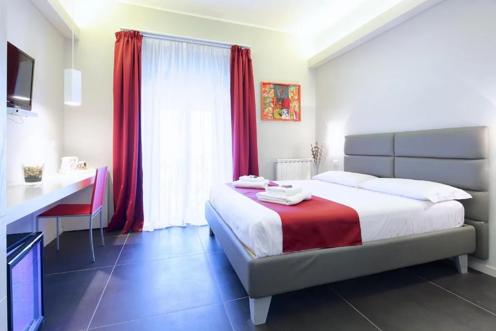 Deluxe Room — NearHome Smart Suites Guest House