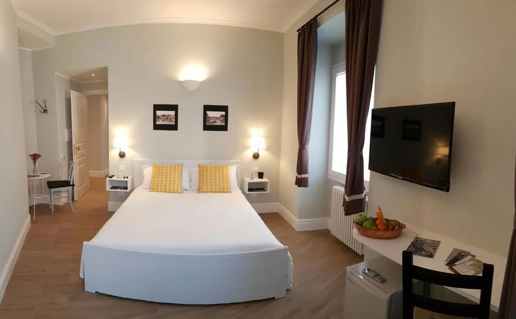 Deluxe Room — Roman Suite Guest House