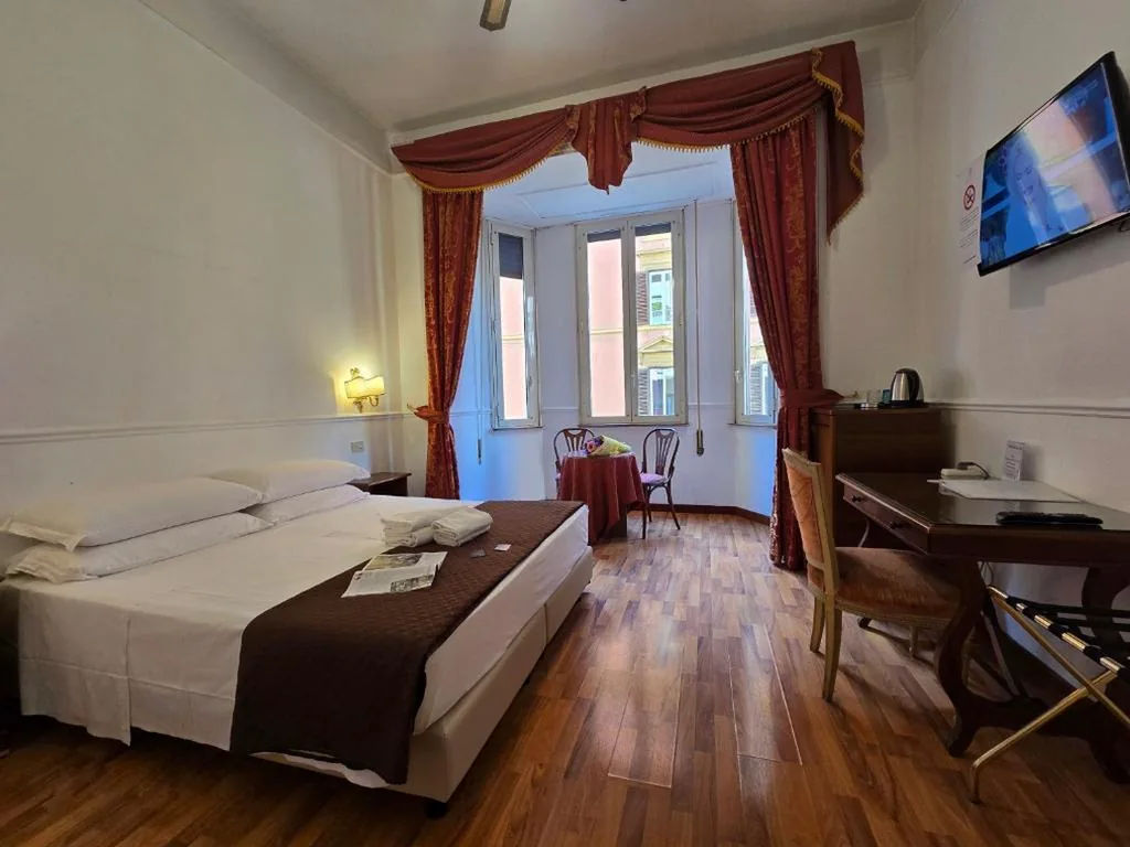 Camera Economy Matrimoniale/Doppia con Letti Singoli — Hotel Porta Pia