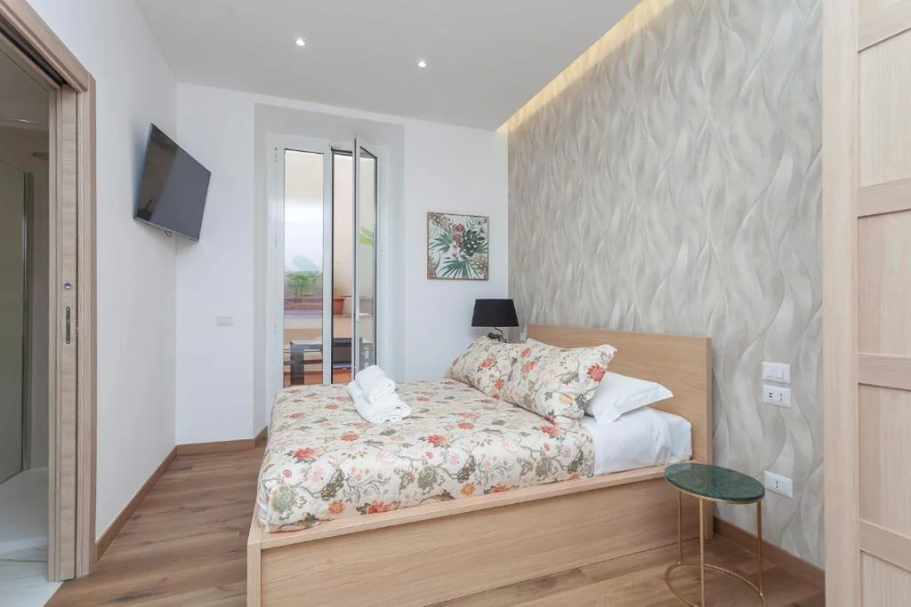 Camera Familiare con Terrazza — Vatican Vittoria Suites – Urban garden – Rooms – Vatican Museum