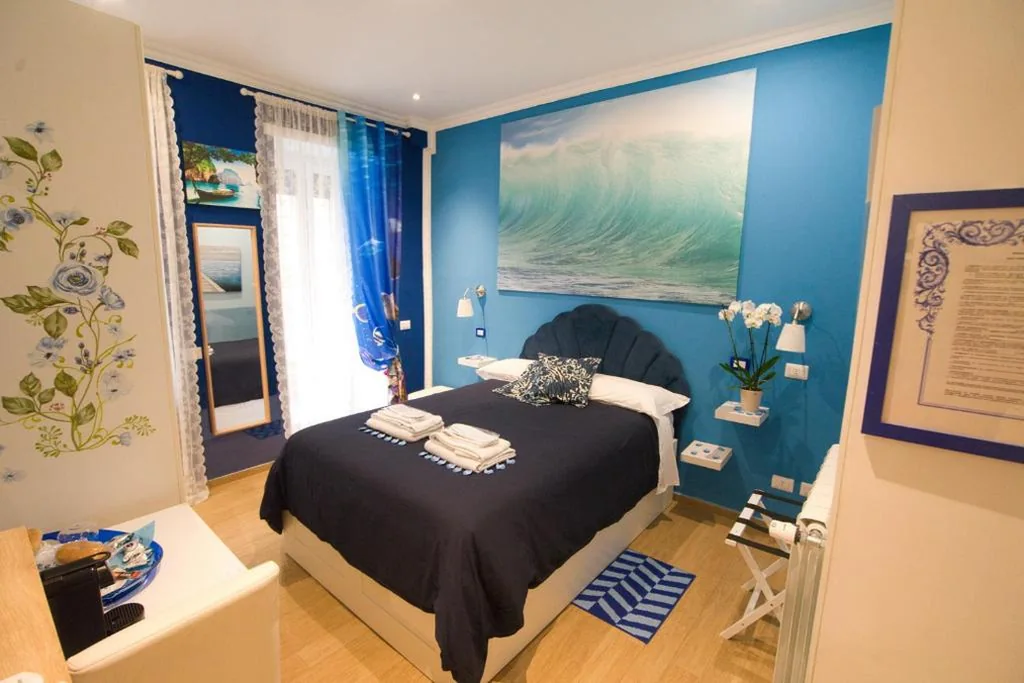 Double Room with Balcony — Etere in Prati Rooms
