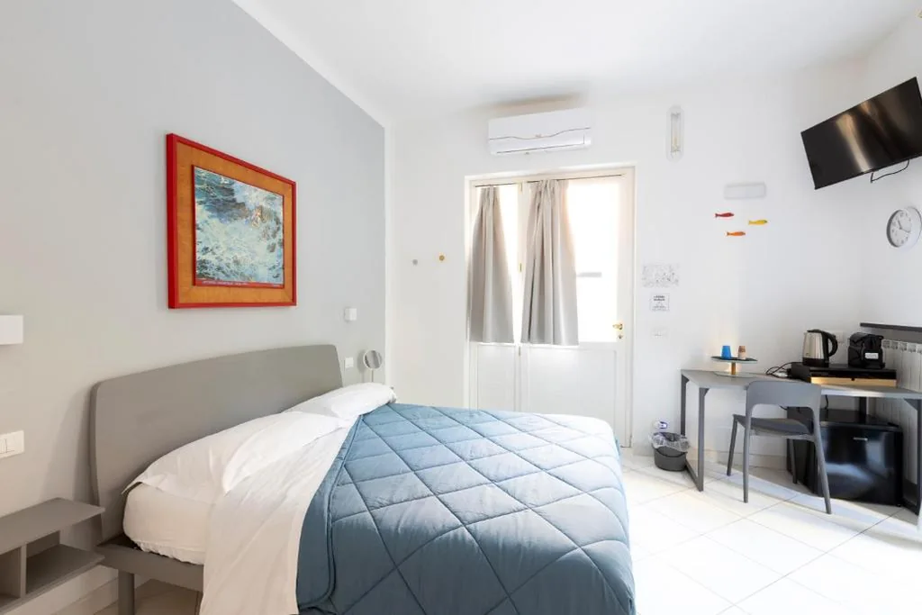 Camera Matrimoniale con Letto Supplementare — Camere Margot