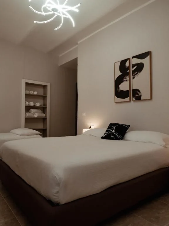 Camera Matrimoniale con Letto Supplementare — Paola HOME