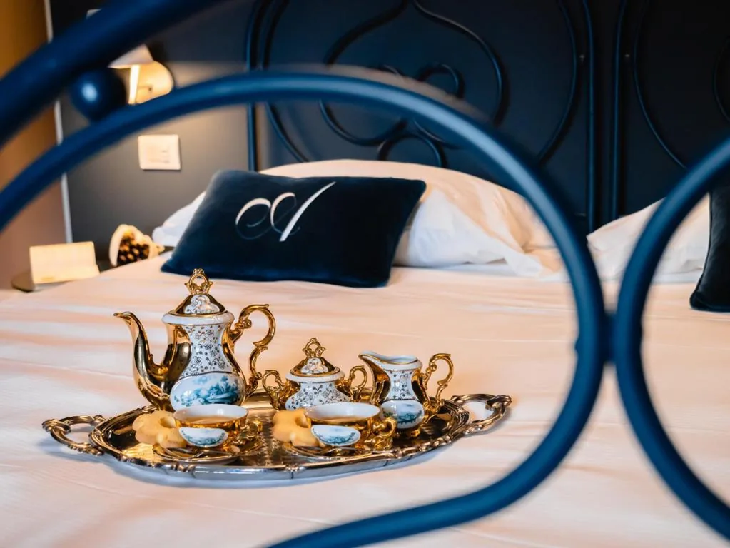 Camera Matrimoniale con Vista Giardino — L’americano Luxury Rooms