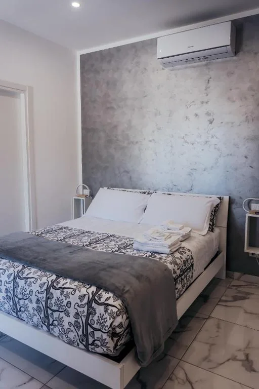 Camera Matrimoniale Deluxe con 1 Letto Supplementare — Capitani Guest House