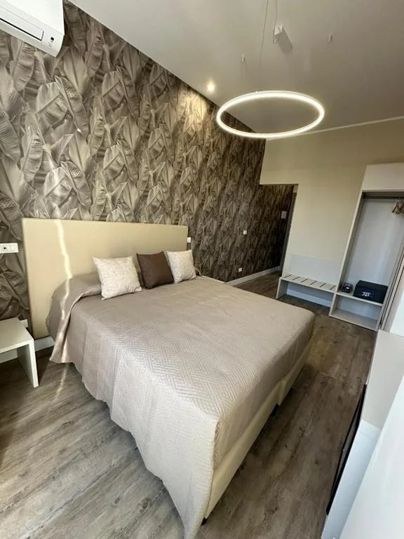 Camera Matrimoniale Deluxe — TrevInn Suites