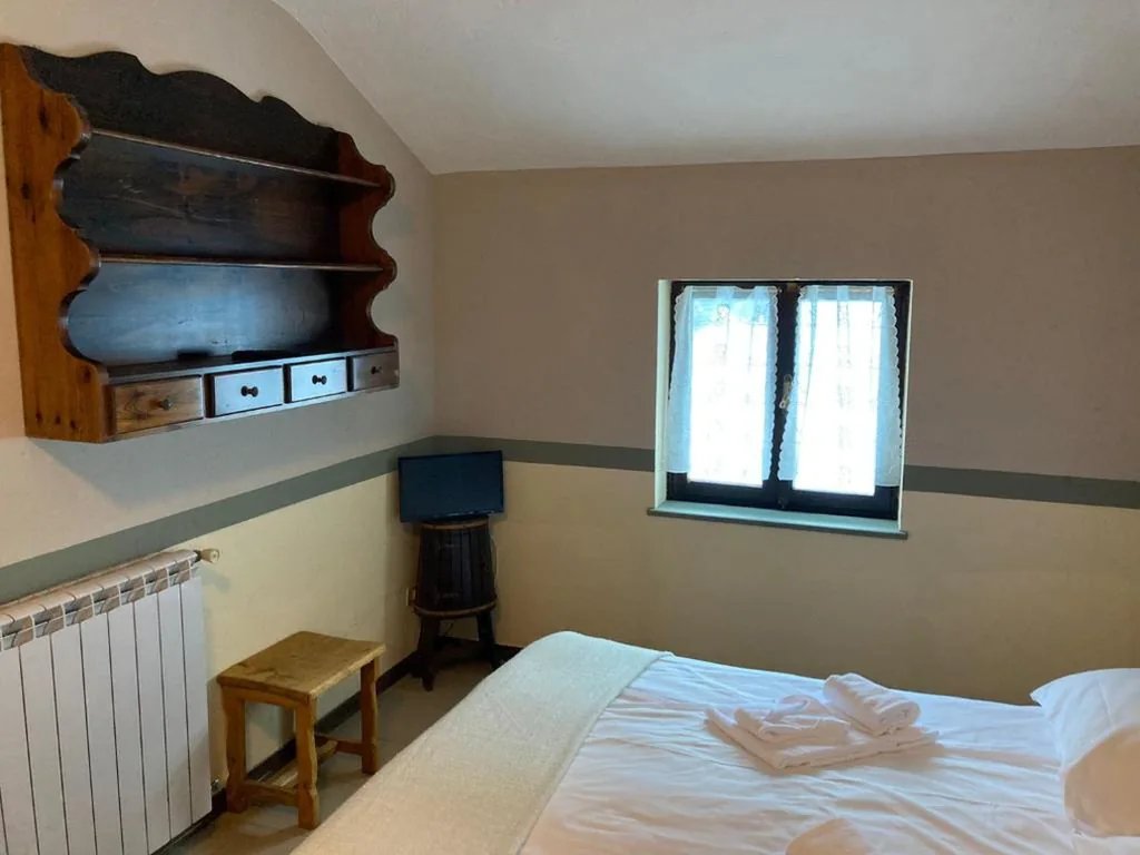Camera Matrimoniale/Doppia con Letti Singoli — Chalet Capannina