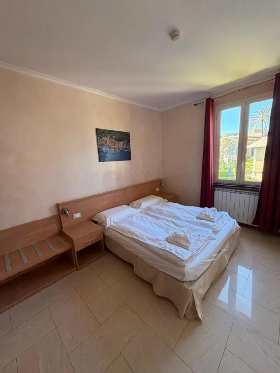 Comfort Quadruple Room — Hotel Villa Flora