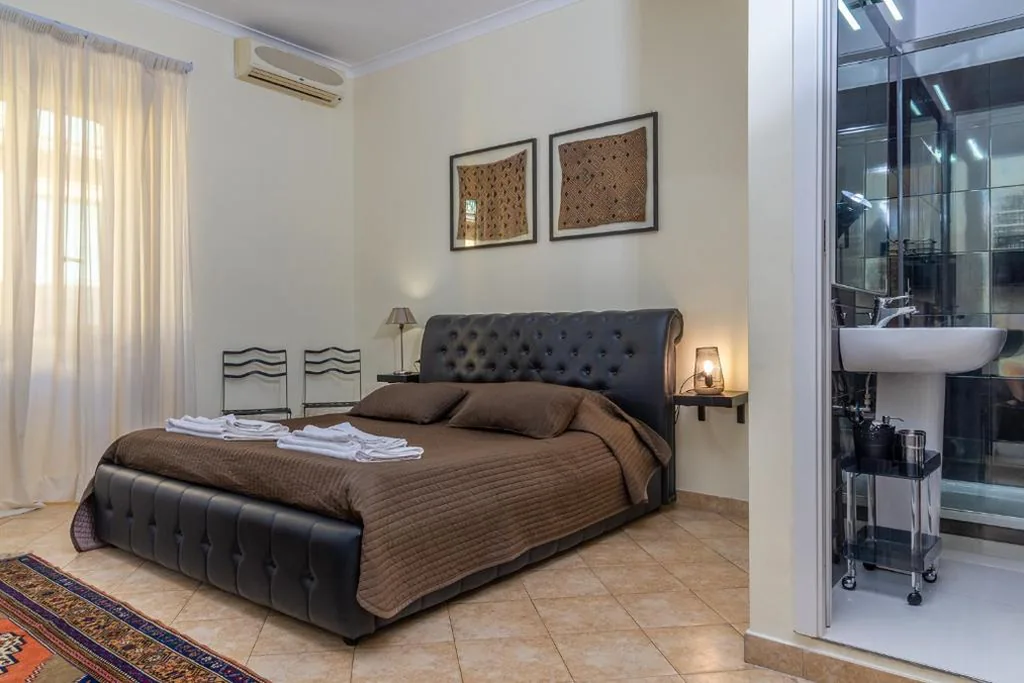 Quadruple Room with Private Bathroom — Camere del Camerlengo