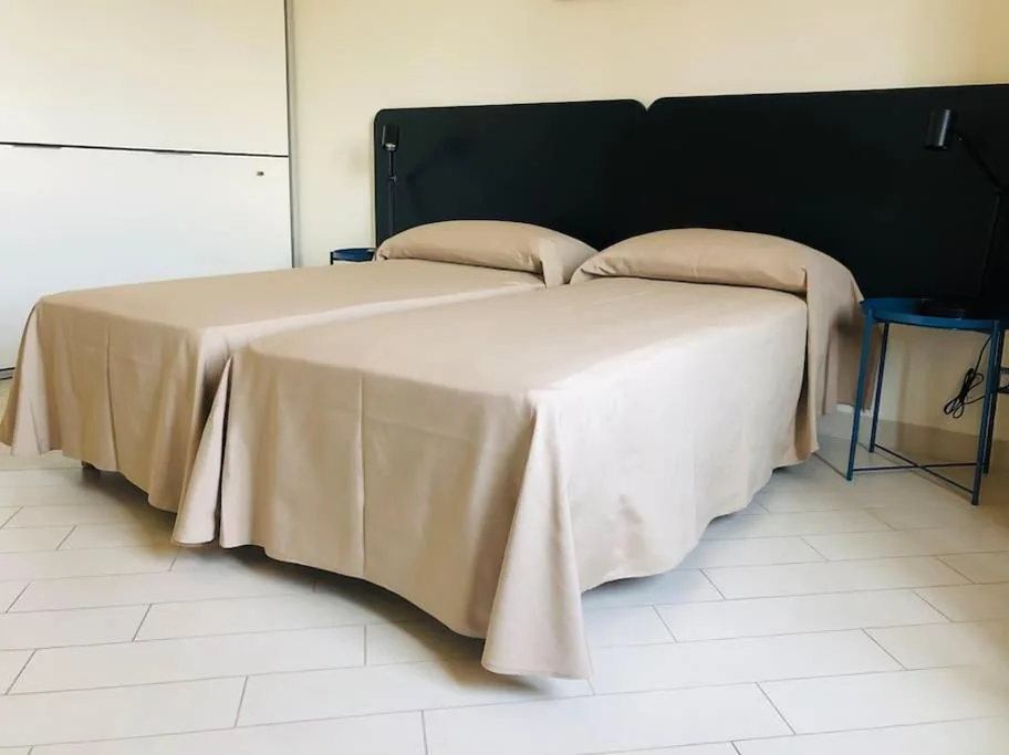 Camera Quadrupla con Bagno Privato — DomusTyche Guest House