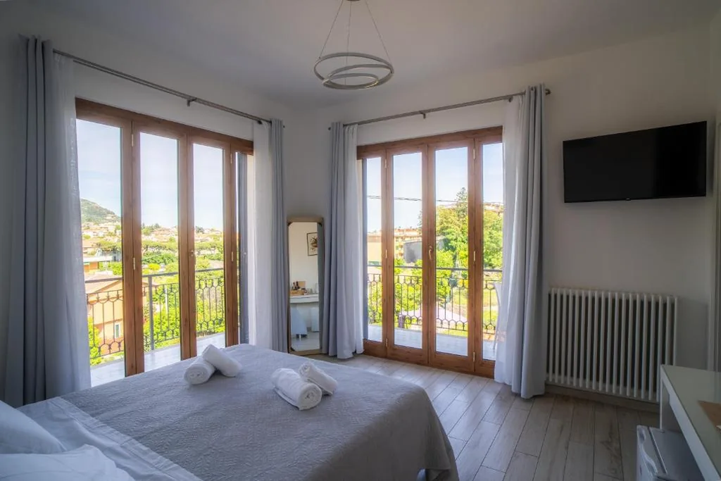Quadruple Room with Private Bathroom — Villa Mafalda