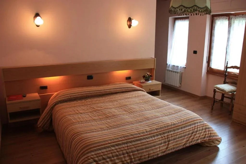 Quadruple Room with Balcony — Hotel Bellevue