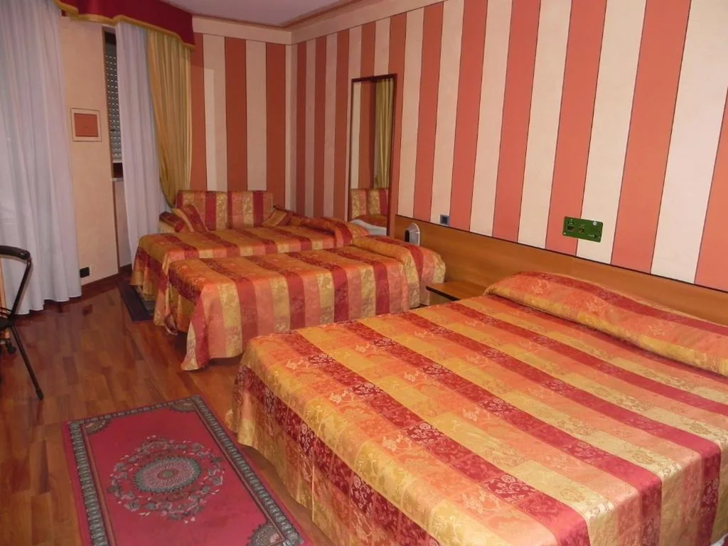 Quadruple Room with Balcony — Hotel La Ruota