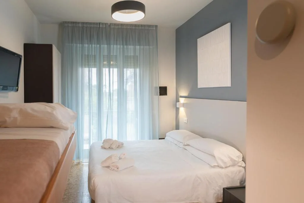 Quadruple Room with Balcony — La Caravella
