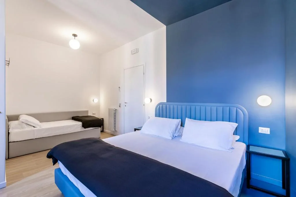 Quadruple Room with Balcony — Luciano San Giovanni Guest House