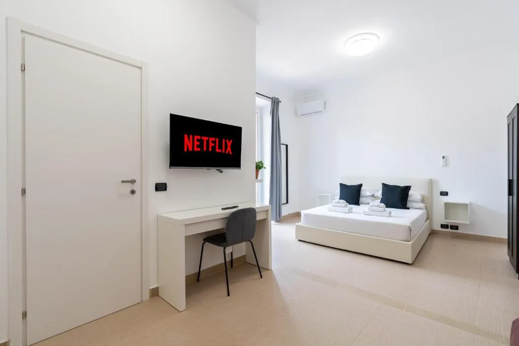 Quadruple Room with Balcony — San Giovanni Boutique Suites