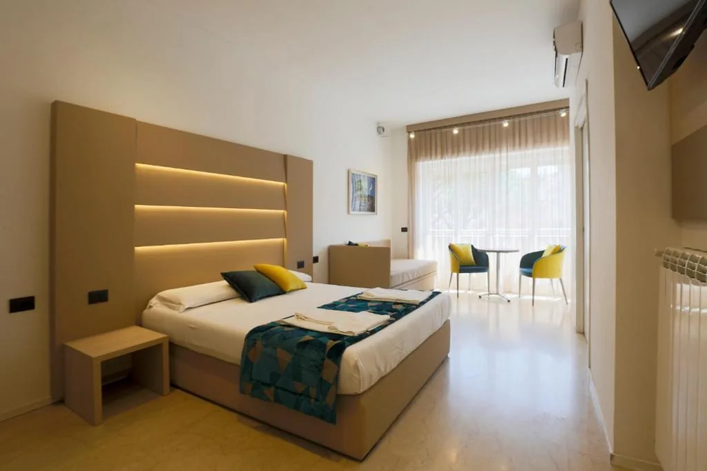 Camera Quadrupla Deluxe — DaVinci Relais Guest House