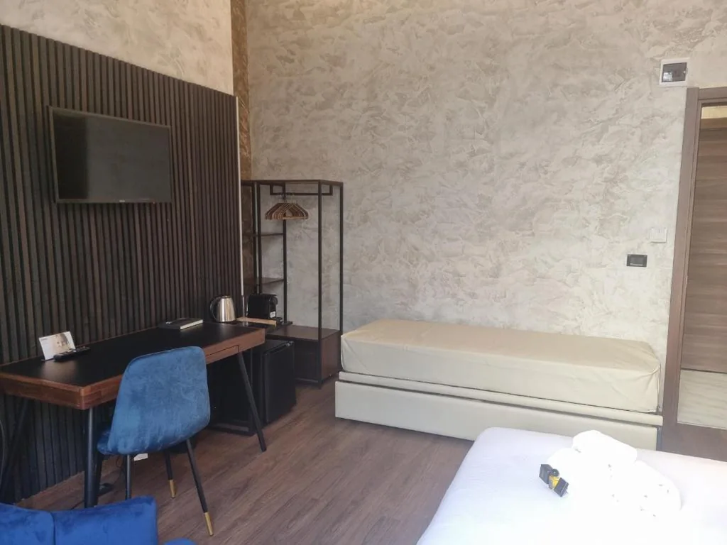 Camera Quadrupla Deluxe — Domus Aquae Rooms & Wellness SPA