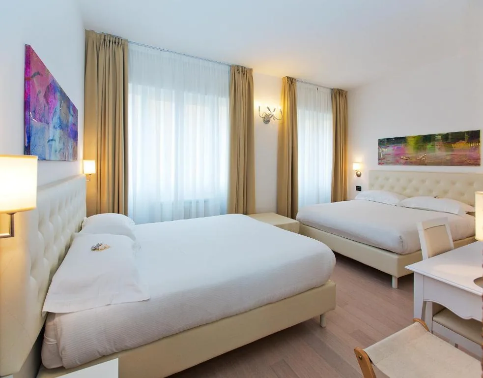 Deluxe Quadruple Room — Hotel Mainè