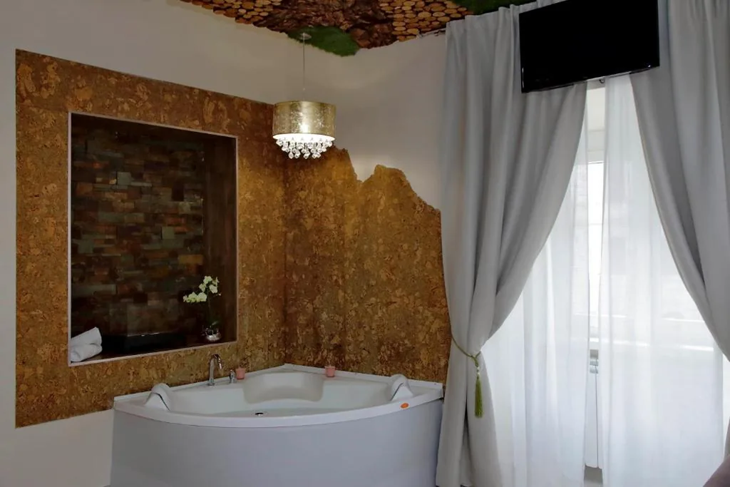 Camera Quadrupla Deluxe — Suite Paradise Rome Guest Rooms