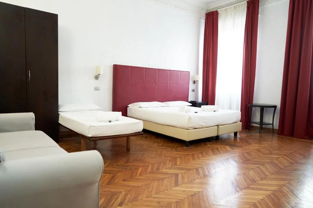 Camera Quadrupla Deluxe — Target Inn Rooms