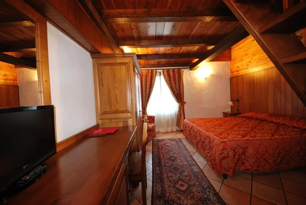 Quadruple Room — Hotel Bellevue
