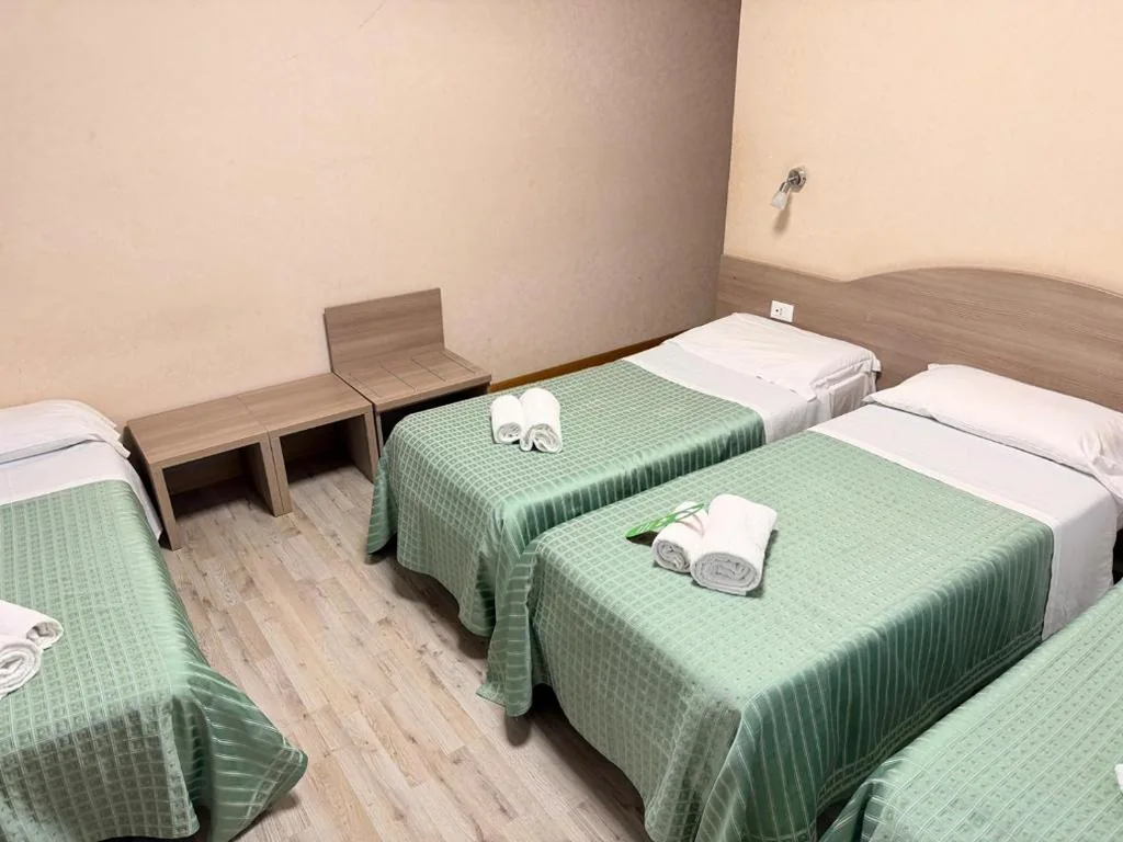 Quadruple Room — Hotel Concorde