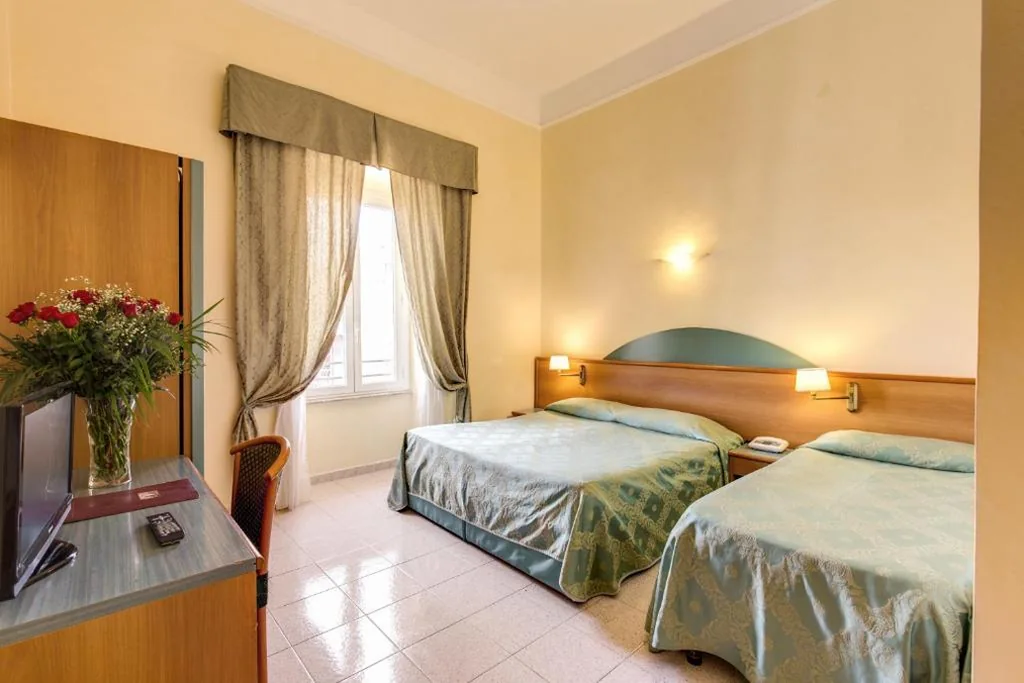 Quadruple Room — Hotel Contilia