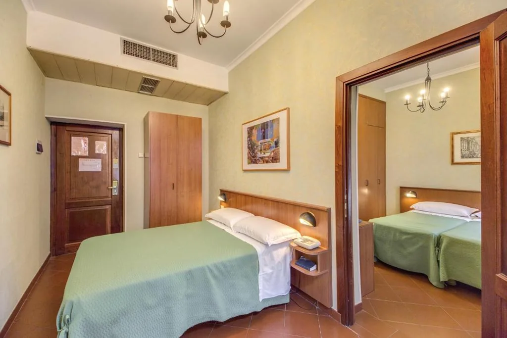 Quadruple Room — Hotel Corona