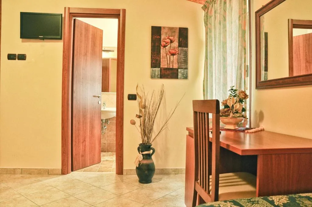 Quadruple Room — Hotel Dei Pini