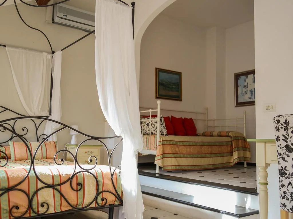 Quadruple Room — Hotel Delle Rose
