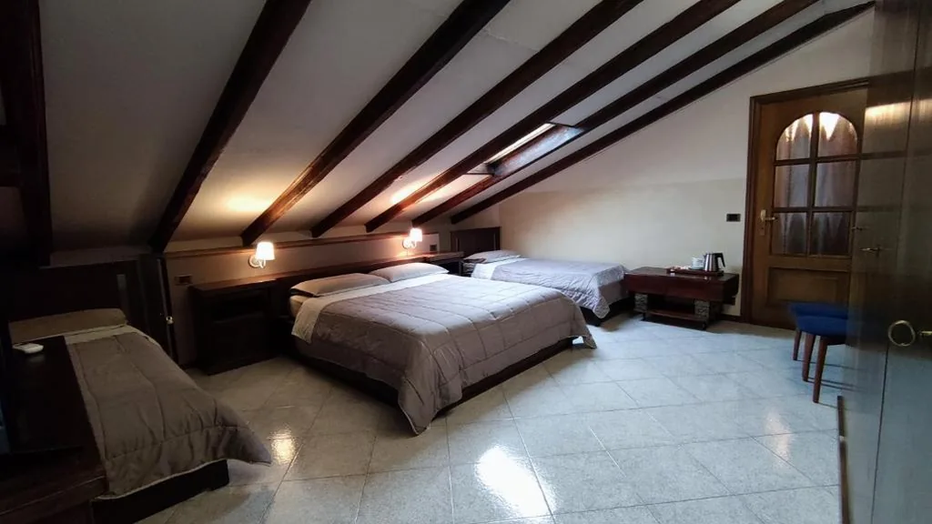 Quadruple Room — Hotel Emiliana