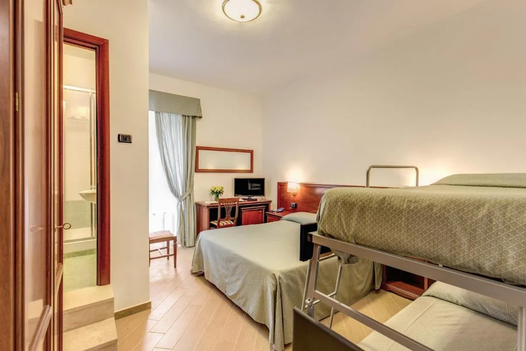 Quadruple Room — Hotel Flavio
