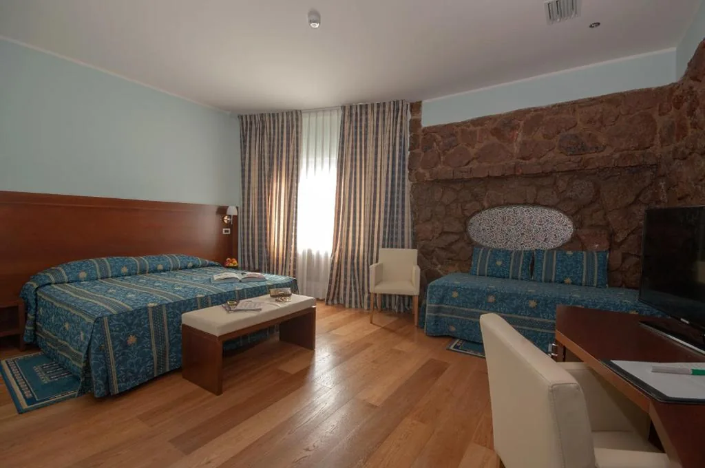 Quadruple Room — Hotel La Pergola