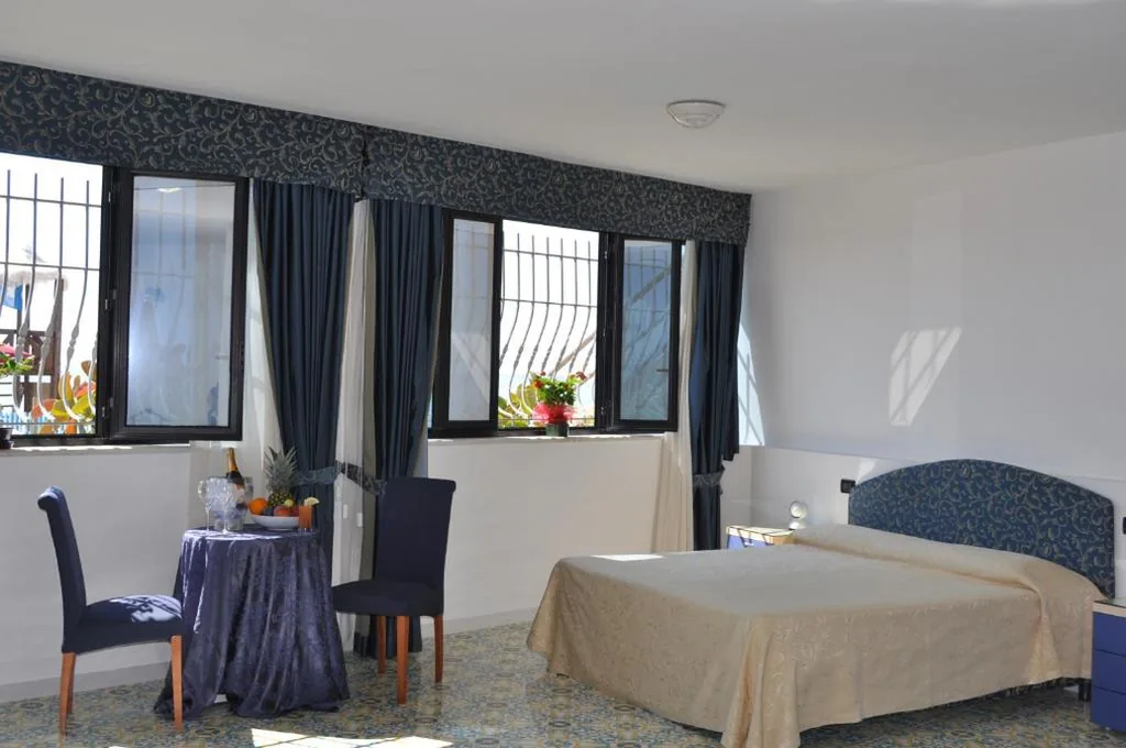 Quadruple Room — Hotel La Playa