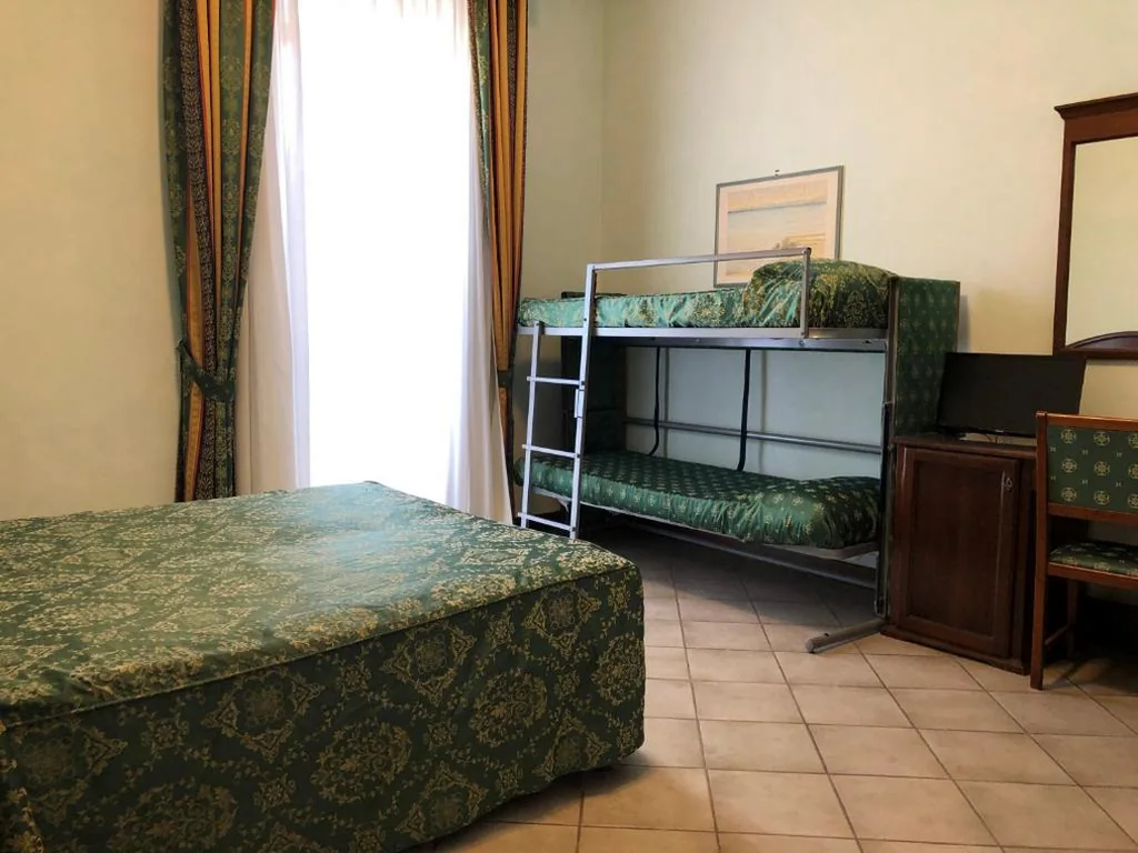 Quadruple Room — Hotel Zodiaco