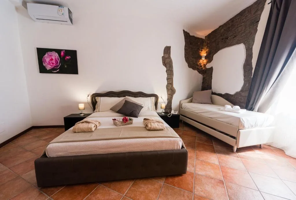 Quadruple Room — Le Undici Rose Hotel