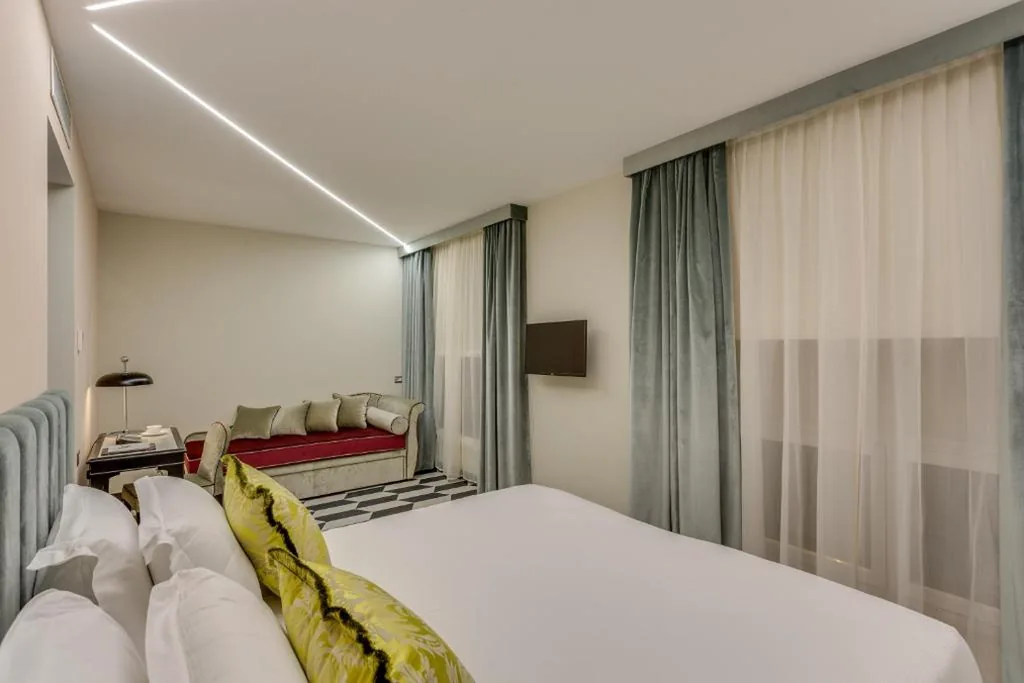Quadruple Room — Otivm Hotel