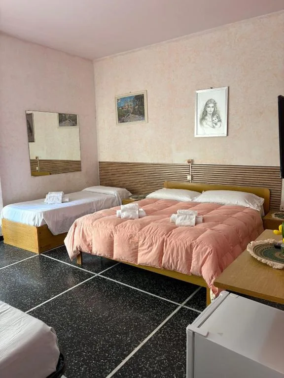 Camera Quadrupla Premium — Hotel & Trattoria Le Caravelle