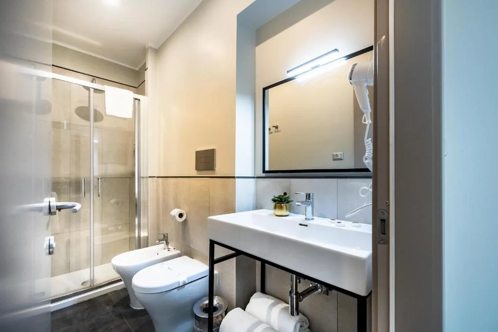 Premium Quadruple Room — The Cross Hotel