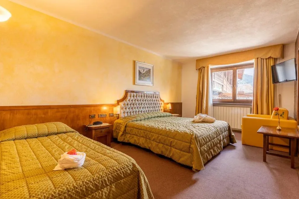 Standard Quadruple Room — Hotel Des Alpes
