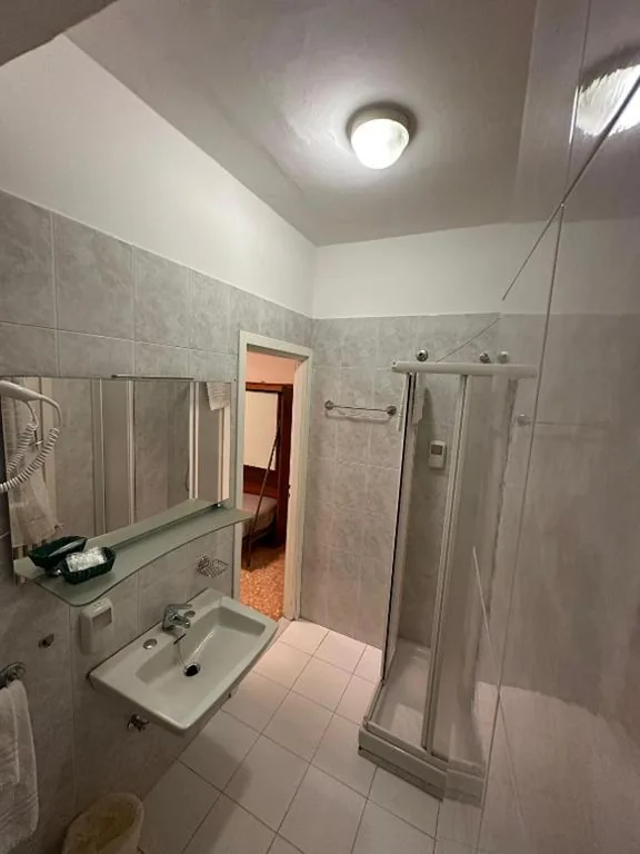 Standard Quadruple Room — Hotel Svizzera