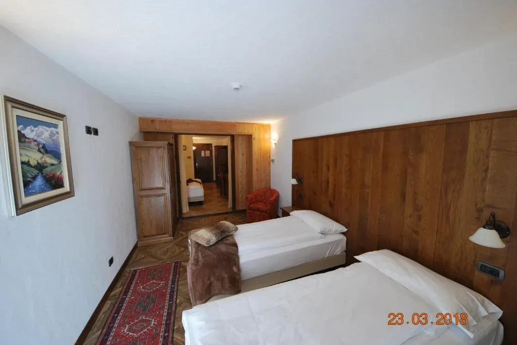 Superior Quadruple Room — Hotel Bellevue