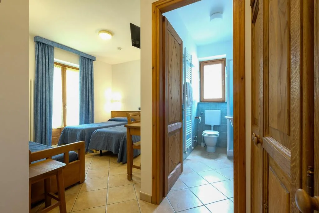 Superior Quadruple Room — Hotel Casalpina Don Barra