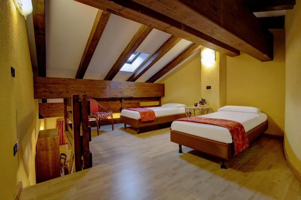 Superior Quadruple Room — iH Hotels Courmayeur Mont Blanc